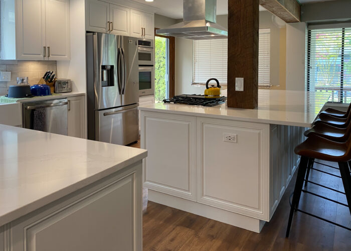 Custom kitchen with bar seating & integrated appliances in Aldergrove, Langley, BC.