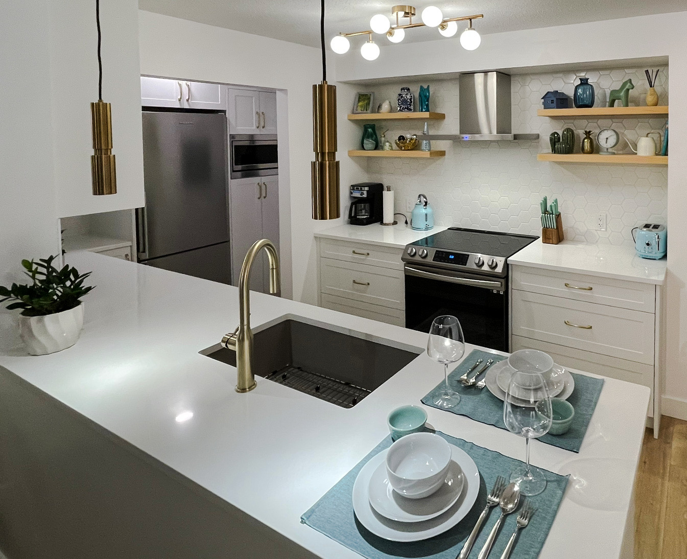 Shaker White Custom Kitchen Cabinet & durable quartz surfaces in Downtown Vancouver, BC.