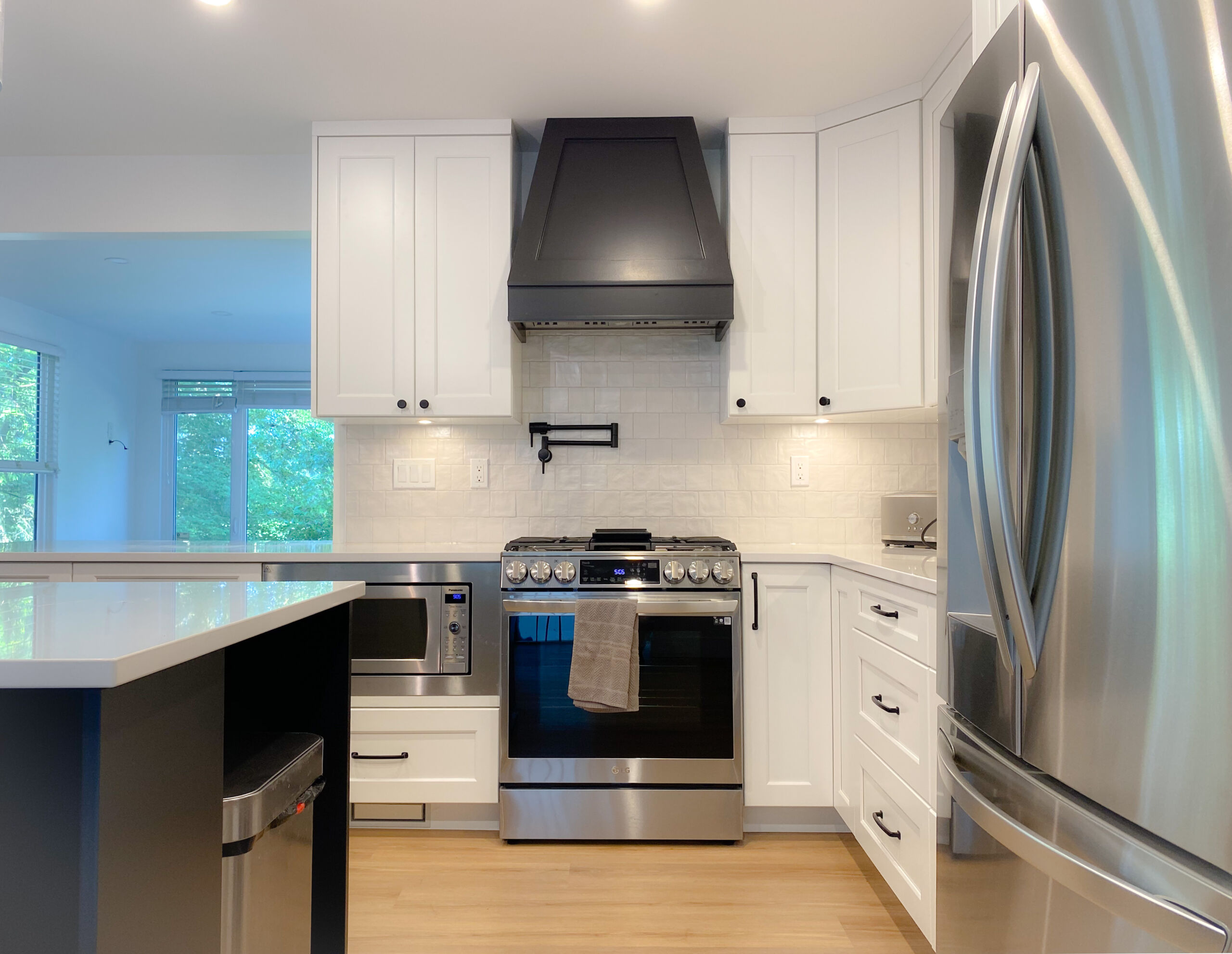 Shaker White Kitchen Cabinet & contemporary hardware accents in Cloverdale, Surrey, BC.