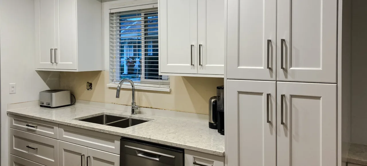 Shaker White Kitchen Cabinets & durable quartz surfaces in Newton, Surrey, BC.