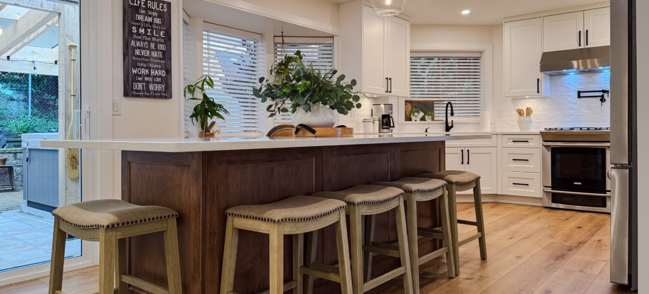 Overall kitchen with maple island and Dream White perimeter cabinets & crisp cabinetry design in Murrayville, Langley, BC.