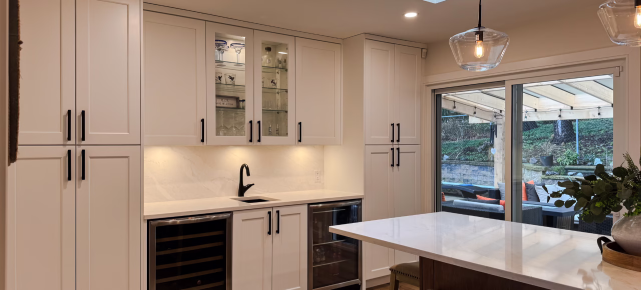 Beverage bar close-up with dual wine fridges and prep sink & functional storage solutions in Murrayville, Langley, BC.