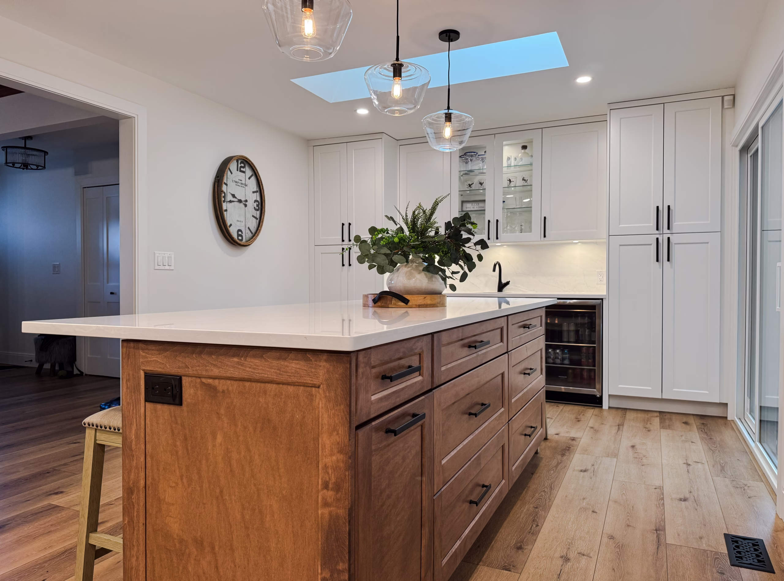Island drawers with matte black pulls & elegant backsplash in Murrayville, Langley, BC.