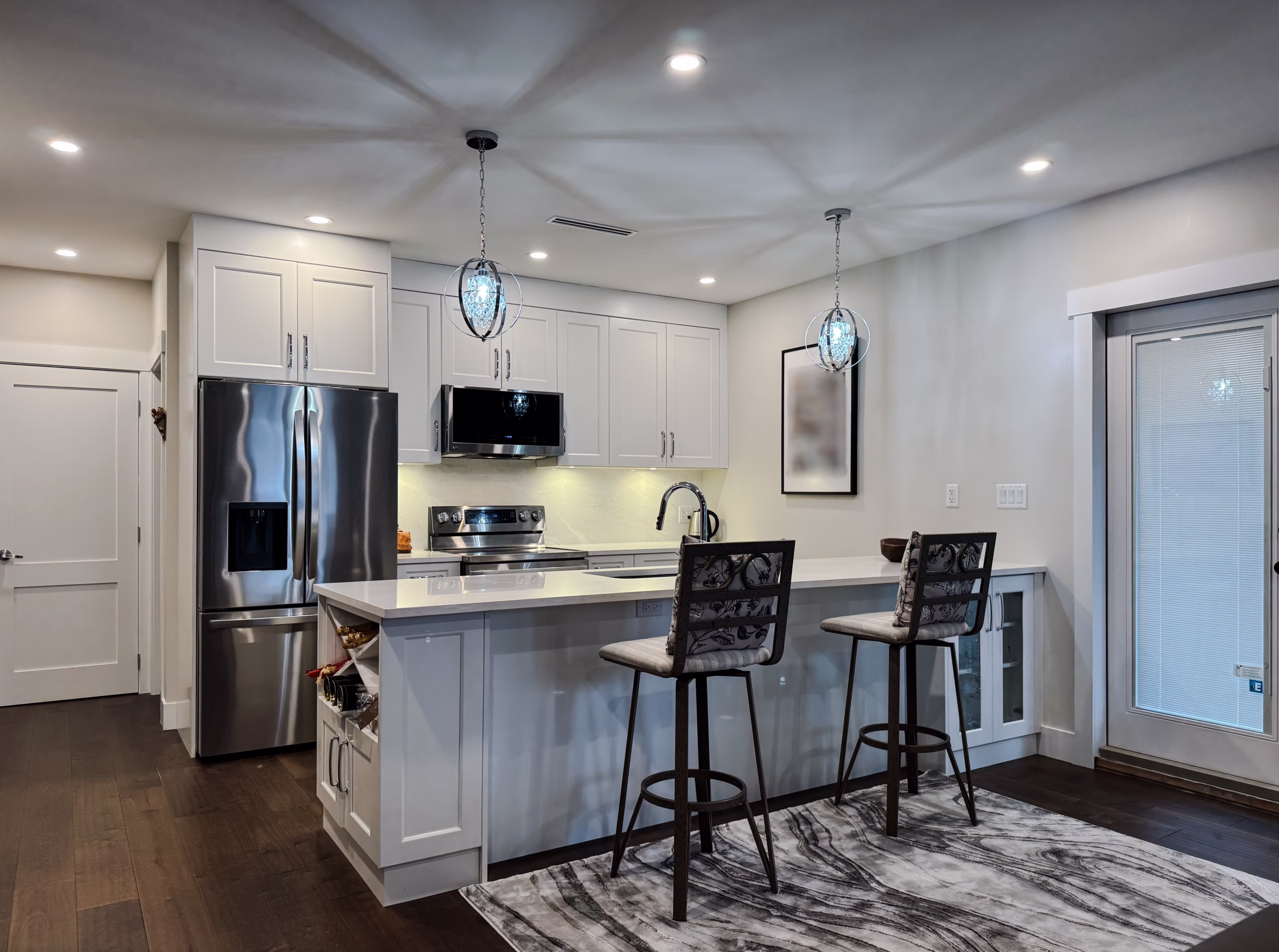 Dream White RTA kitchen cabinets & crisp cabinetry design in Queen's Park, New Westminster, BC.