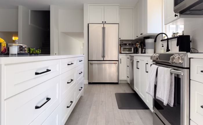 Dream White RTA cabinets with soft-close drawers â€” contemporary hardware accents in South Meadows, Pitt Meadows, BC.