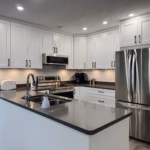 South Surrey kitchen with Dream White Shaker cabinets, peninsula sink and stainless steel appliances in Sunnyside Park.