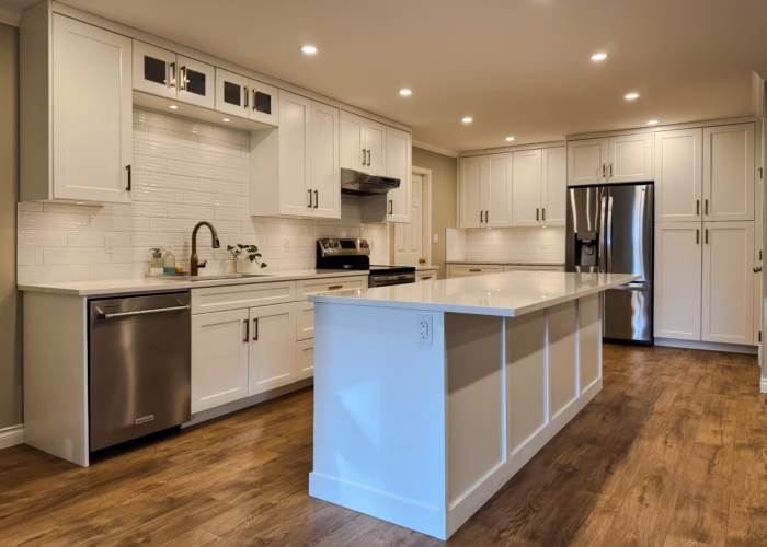 Langley kitchen cabinets with Dream White Shaker doors, large island and open-concept layout in Brookswood.